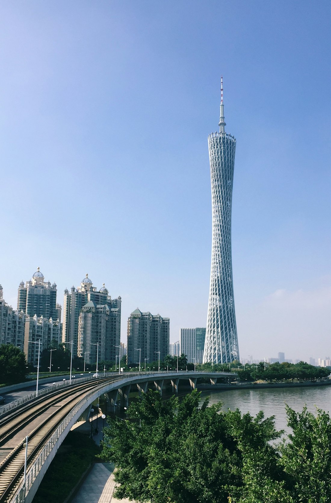 Canton Tower rising above the Pearl River and Guangzhou apartment blocks on a clear day